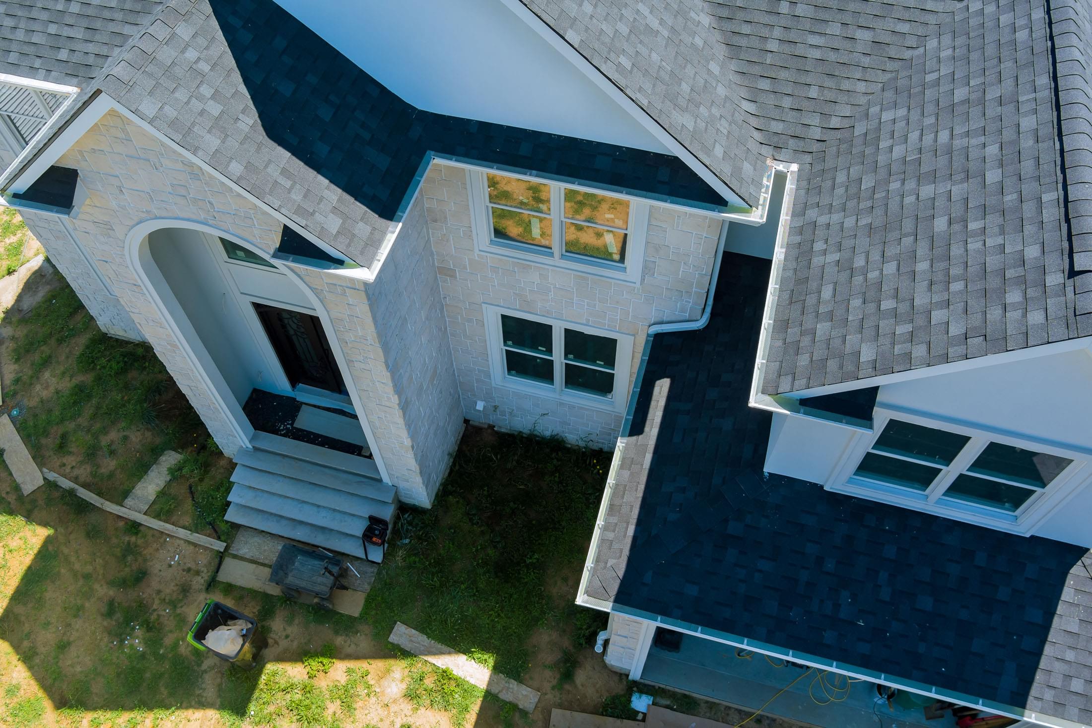 aerial view asphalt shingles construction site roofing house with new window