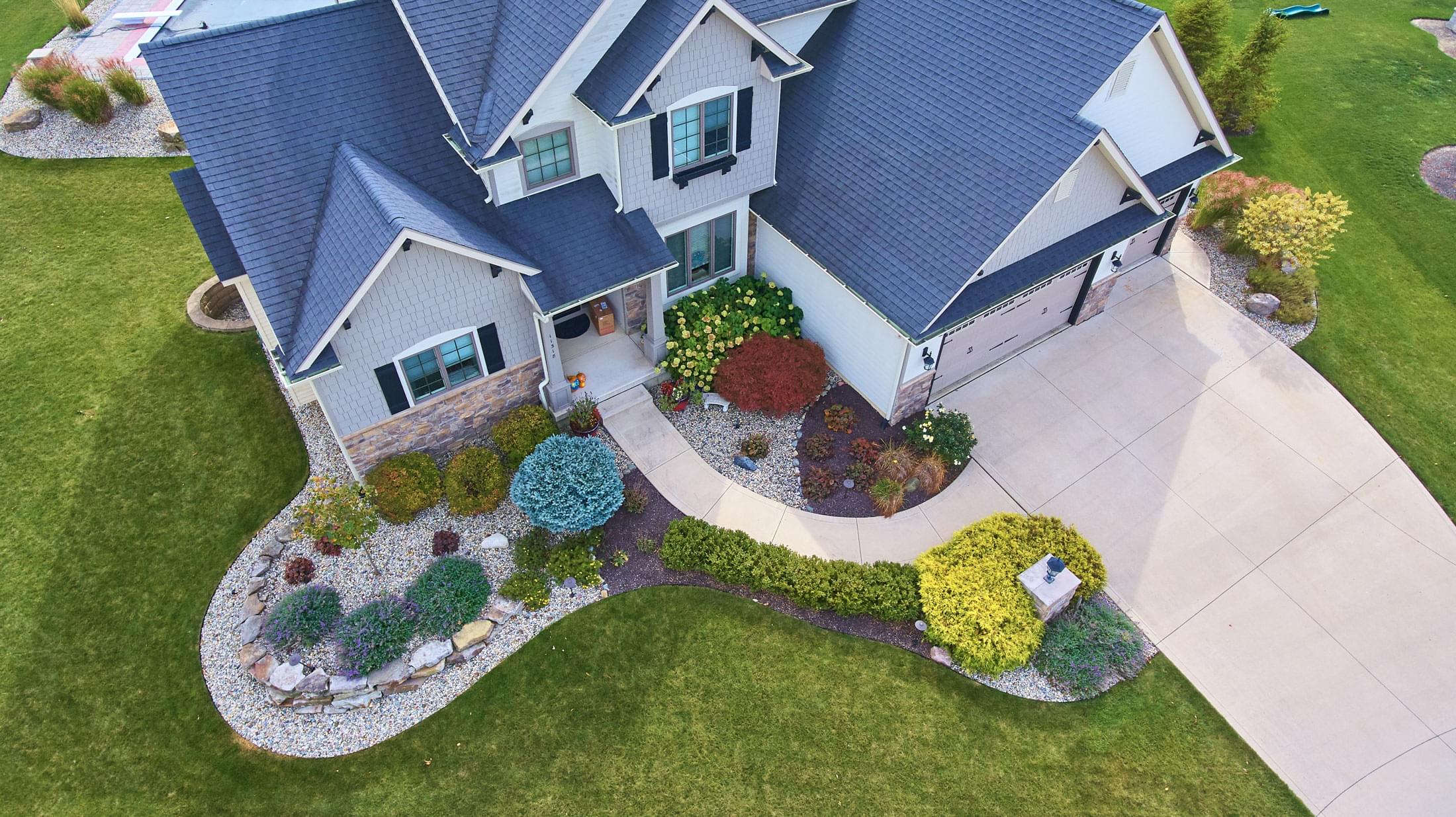 image view outside traditional american house with beautiful summer landscaping