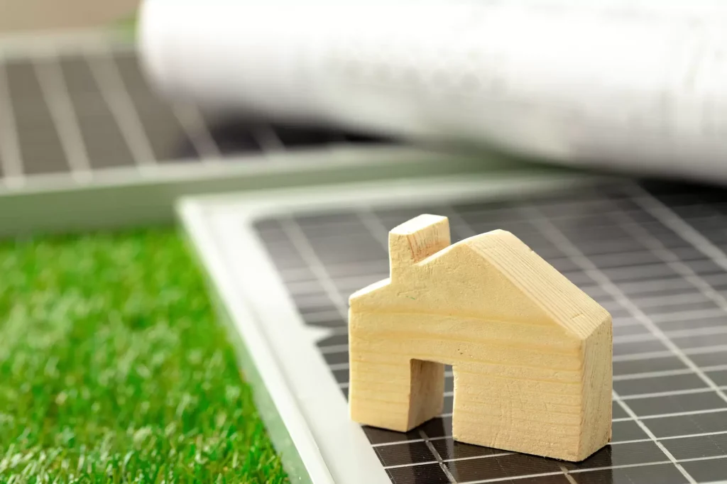 wooden house miniature solar panel close up web